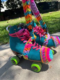 a pair of roller skates with colorful knitted socks and boots attached to them