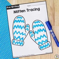 the mitten tracer is next to a blue marker on a piece of paper