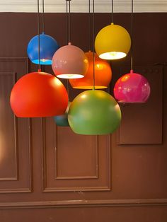 multicolored lights hanging from the ceiling in a room