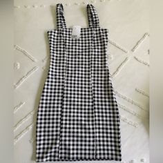 Black & White Checkered Mini Dress New With Tags! Size Xs, Never Worn Black Fitted Cotton Bodycon Dress, Fitted Black Cotton Bodycon Dress, H&m Black Mini Dress For Day Out, Casual Black Cotton Bodycon Dress, Casual Fitted Black And White Dress, Casual H&m Dress For Date Night, Fitted Black And White Mini Dress, Black And White Mini Dress For Summer Day Out, Fitted Black And White Casual Dress