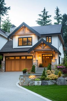 a large house with lots of windows and landscaping