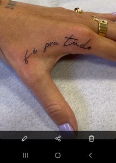 a person's hand with writing on it