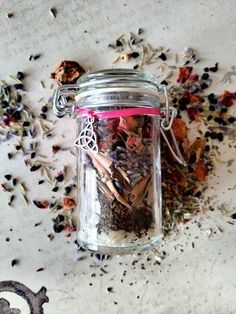 a jar filled with lots of different types of spices