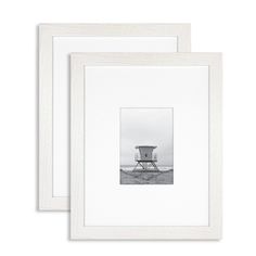 two white frames with a black and white photo in the middle, one has a lifeguard tower on it