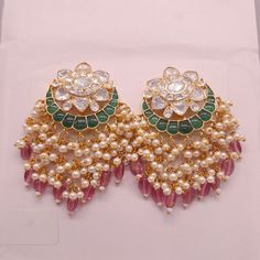 Silver Polki Chandbali, Emerald Earring, Kundan Chandbali, Bridal Jewelery, Traditional Jewelery, 925 Silver Earring, Chandbali, Mossianite *𝐀𝐛𝐨𝐮𝐭 𝐏𝐫𝐨𝐝𝐮𝐜𝐭* Product Code :- TE 1032 Product Type :- Chandbali Earring Product Weight :- 36.573 Gram Gemstone Used :- Moissanite Polki, Labmade Emerald Material :- 925 Sterling Silver, Moissanite Polki, Labmade Emerald Size :- 6x3 CM Intricate, hand-crafted, Pure Silver Polki Earrings, studded with high-quality Moissanite Polki comes with Clip-on, made in 92.5 silver with 22ct gold plating. The product comes with 92.5 silver stamping -Product can be made in gold as well. -If any product is not ready, It takes 2-3 weeks to make in pure silver -We also look forward to Bulk Orders. We shall consider special discount on Bulk Orders. Navrii ( Traditional Green Round Pearl Earrings, White Round Cutdana Earrings, White Tilla Earrings, Polki Chandbali, Kundan Chandbali, Emerald Earring, Bridal Jewelery, Polki Earrings, Chandbali Earrings