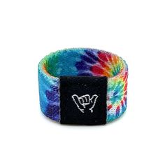 Hang Loose with this trippy tie dye band. Festivals, shows, concerts...wherever your journey takes you, embrace the moment and send good vibes with our most popular band. One size Fits fingers size 6 to 8. 1/2" Width Reversible surf and beachy prints. Elastic blend material. Packaged in natural drawstring gift pouches. Machine washable. Chlorine and saltwater safe. Rave Jewelry For Music Festival With Adjustable Fit, Adjustable Multicolor Jewelry For Music Festival, Adjustable Multicolor Rave Wristband, Adjustable Multicolor Wristband For Summer, Casual Multicolor Wristband, Beachy Prints, Popular Bands, Sending Good Vibes, Hang Loose