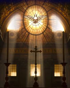 the cross is in front of an ornate window with light streaming through it and beams of light coming from above