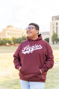 You asked and we delivered! Champion's take on the much-desired script "Aggies" hoodie, this comfy, warm item is perfect for wearing to baseball games or other Aggie sporting events! "Aggies" is embroidered onto the chest, and a kangaroo pocket is featured in front to help keep your hands warm Maroon Hoodie, Baseball Games, Sport Event, Hand Warmers, Kangaroo Pocket, Kangaroo