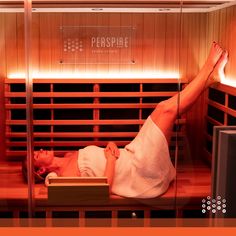 a woman laying down in a sauna