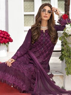 Pakistani Long kameez Salwar Suit for Eid Wear is heavily embellished kameez with dabka, kora, and tilla work done on kameez pairing with Capri pants. This dress is in chiffon fabric which is designed in net purple dupatta for your favorite occasion. Shirt: Chic and sophisticated perfectly describe this simply stunning dress of artisan piece includes intricate hand embellishment. This technique gives our garments a unique look and helps to sustain a traditional craft carried out by skilled artis Unstitched Red Cotton Silk Churidar, Festive Cambric Lawn Suit, Elegant Mulmul Churidar For Navratri, Festive Eid Unstitched Cambric Suit, Festive Eid Cambric Unstitched Suit, Elegant Cotton Sharara For Navratri, Cotton Lawn Suit With Sheer Dupatta In Saree Style, Elegant Cambric Traditional Wear For Navratri, Festival Cambric Dupatta With Dabka