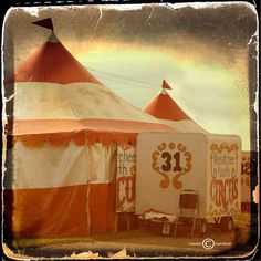 an orange and white tent with the number 31 on it