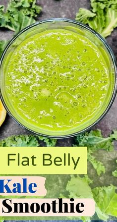 a green smoothie in a glass bowl with kale leaves around it and the text flat belly kale smoothie