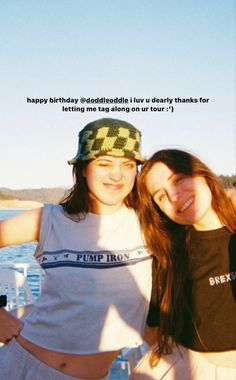 two women standing next to each other on a boat in the water with a caption above them