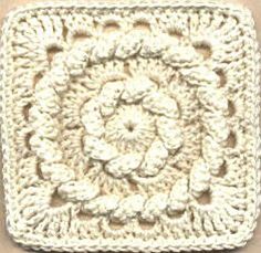 a crocheted square with a flower in the center