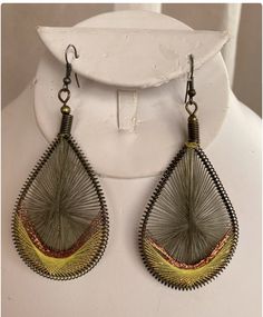 CLASSY RAGS VINTAGE….. on Etsy. 
VINTAGE is ALWAYS in FASHION !!

From the Boho era, a beautifully made pair of Macramé string earrings. Large tear drops, olive green with a golden yellow and copper band at the bottom. Intricate knotting, beautiful result. Light. 3" L x 1 1/2" W. Unique Handmade Adjustable Teardrop Earrings, Handmade Yellow Bohemian Teardrop Earrings, String Earrings, Tear Drops, Tear Drop Earrings, Earrings Large, Golden Yellow, Tear Drop, Boho Hippie