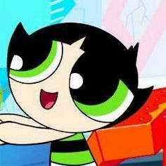 the powerpuff character is holding an orange object