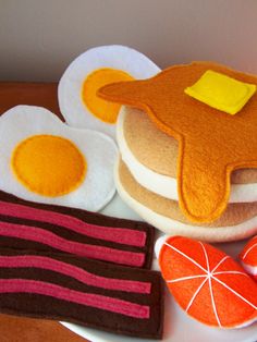 pancakes, eggs and candy are arranged on a plate