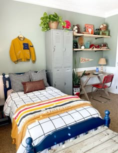 a bedroom with a bed, desk and locker