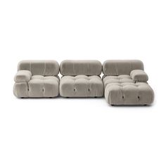 a grey couch with two recliners and one footstool in the middle