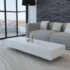 a living room with couches, coffee table and large glass windows overlooking the city