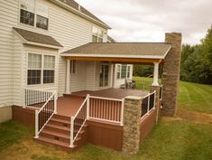 a house with a covered porch and steps leading up to the front door