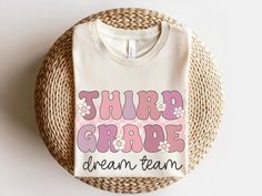 a white t - shirt with the words thurp grape dream team on it