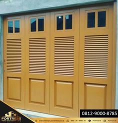 a yellow garage door with shutters on it