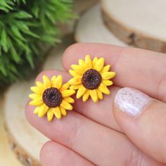 This Sunflower Earrings is the prettiest, one of a kind jewelry that you have been looking for! If you want to have a beautiful yellow flower earrings, or just searching for the perfect gift for girls, or bridesmaids, then you have came to the right place! D E T A I L S: * Handmade Sunflower Stud Earrings * Made from Polymer Clay * Width: 0.7 inches (1.8 cm) * Earring posts: Stainless steel * Earrings are light and easy to wear * Earrings arrive nicely packed in a eco friendly box You can also a Summer Gift Jewelry With Sunflower Design, Yellow Flower Shaped Jewelry With Sunflower Print, Yellow Flower-shaped Jewelry With Sunflower Print, Yellow Sunflower Design Earrings For Summer, Summer Sunflower Design Jewelry, Yellow Sunflower Design Earrings For Gift, Summer Flower Earrings With Sunflower Design, Yellow Sunflower Design Earrings Gift, Yellow Sunflower Design Earrings As Gift