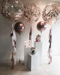 some balloons that are hanging from the wall