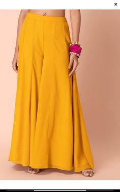 🌸Here we are with these Georgette Palazzo perfect to pair with any Kurta, Croptop or blouse 👖Item details:- Fabric: Georgette Length: As per measurements Linning: Shantoon Waist: Elasticated Closure: Side zip and hooks Pattern: Wide Leg Palazzo ➡️Kindly select your size from the size chart in the image section. ➡️Color of the actual product may vary slightly from the image shown due to screen resolution . Traditional Fitted Wide Leg Palazzo Set, Fitted Traditional Wide Leg Palazzo Set, Bollywood Style Straight Pants For Festivals, Eid Straight Pants Palazzo Set, Bollywood Straight Pants For Festivals, Anarkali Pant Set For Diwali, Traditional Wide Leg Palazzo Set For Festivals, Fitted Straight Pants For Diwali, Festive Ankle-length Pants For Diwali