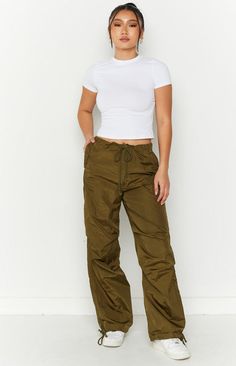 Our Frankie Parachute Pants are just the item your wardrobe needs! With endless styling options these on trend pants will be your daily go-to. Whether its a street look paired with a crop and sunnies or dress up with a corset and heels. These cargos also feature an adjustable tie waist and ankle cuff, style flared or gathered around the ankle to switch it up! Khaki Parachute Pants, Trend Pants, Summer Bottoms, Prom Midi Dress, Summer Playsuit, Wardrobe Needs, Semi Formal Dresses, Sweater Crop, Strapless Tops