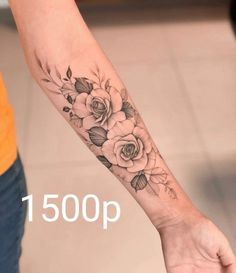 a woman's arm with flowers on it