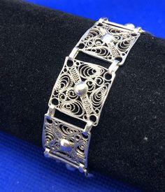 * Vintage 925 Sterling Silver Beaded Filigree Delicate Square Panel Bracelet * Length: 7-1/2" * Width: 5/8" * Weight: 9.3g * Closure: Spring ring * Marked: STERLING * 925 * Condition: As pictured. * S5469    Exported By ExportYourStore :) Classic Adjustable Bracelet With Intricate Design, Classic Sterling Silver Bracelet With Intricate Design For Wedding, Classic Adjustable Sterling Silver Bracelet With Intricate Design, Classic Sterling Silver Filigree Bracelet Gift, Classic Sterling Silver Bracelet With Intricate Design, Classic Sterling Silver Bracelet With Intricate Design As Gift, Adjustable Sterling Silver Filigree Bracelet, Adjustable Filigree Sterling Silver Bracelet, Classic Sterling Silver Bracelet With Filigree