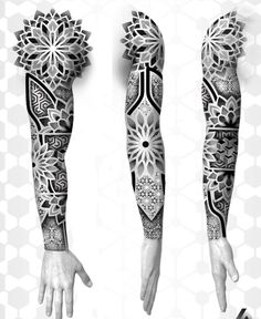 the arm and arms are covered in intricate tattoos, with geometric designs on each arm