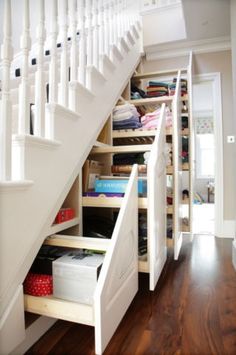 the stairs in this home are full of storage