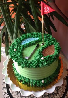 a green cake with a golf hole on it