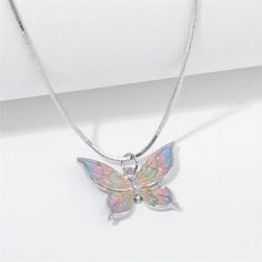 Description:Enamel Butterfly NecklaceSpecifications:Material: copper, enamel, silverColors: SilverSize: 40 cm + 5 cm extWeight: 6 g/pc Upgrade your style with our Enamel Butterfly Necklace. With a charming design and playful colors, this necklace will add a touch of whimsy to any outfit. Stand out with this unique accessory and make a statement without saying a word! Butterfly Chain Necklace, Butterfly Chain, Playful Colors, Enamel Butterfly, Handmade Butterfly, Color Butterfly, Delicate Butterfly, Butterfly Pendant Necklace, Wedding Banquet