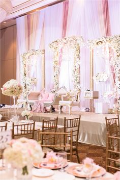 a banquet hall with tables and chairs set up for a formal function