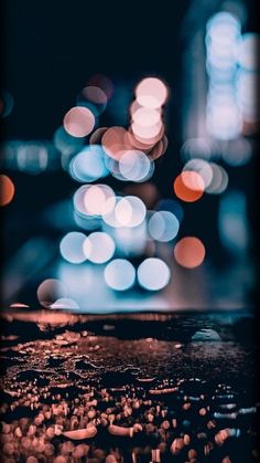 blurry image of city lights at night from the top of a building in an urban area