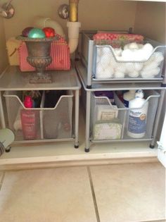 the shelves are organized with baskets and toiletries