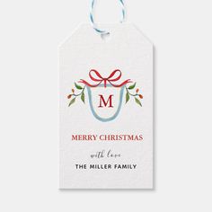 a christmas gift tag with the letter m on it