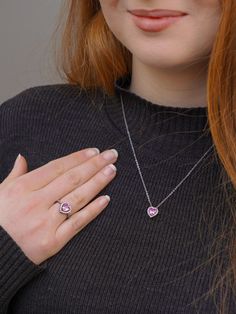 💕 Share your belief in love with the world through the Sparkling Pink Elevated Heart Ring. Featuring a heart-shaped pink artificial crystal nestled within its mount, surrounded by a dazzling pavé setting on the front of the band, this ring exudes elegance and charm. Elevate your style by pairing it with Pandora Timeless' pink Heart pendant and other timeless jewelry pieces. Let its beauty captivate all who behold it. 💖✨ Crafted with care, the 'Pandora Necklace' is the perfect choice for any occasion, be it birthdays, anniversaries, or simply to show appreciation to the remarkable woman in your life. Whether she's a nurturing mother, a loyal sister, a cherished friend, or a beloved partner, this necklace offers a personalized and heartfelt token of gratitude. Its design, inspired by the e Pandora Pink Heart Necklace, Pink Sterling Silver Heart Cut Necklace, Pink Birthstone Heart Pendant Necklace, Pink Sterling Silver Open Heart Necklace, Pink Sterling Silver Heart Necklace, Valentine's Day Pink Sterling Silver Heart Necklace, Pink Heart Charm Necklace In Cubic Zirconia, Pink Cubic Zirconia Heart Charm Necklace, Pink Birthstone Jewelry For Anniversary