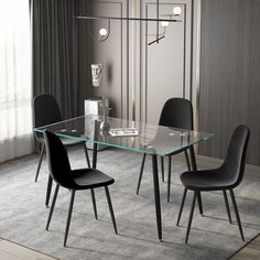 a glass dining table with four chairs around it