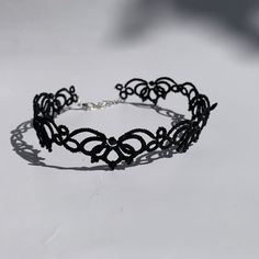 This black lace choker is perfect for your next Goth event! A unique leafy floral design can be great for everyday wear or evening, depending on your chosen color. This is a handmade tatting lace, so you can pick from many colors that I have available. If it is not on a drop-down list, don't hesitate to contact me first. I'm sure we will find the solution. GET FREE UPGRADED SHIPPING ON ORDERS OVER $110! Each piece of Monarch lace jewelry is uniquely handmade, so the exact measurements can vary a Victorian Gothic Wedding, Alt Bride, Black Lace Choker, Choker Handmade, Lace Choker, Lace Jewelry, Tatting Lace, Gothic Wedding, Handmade Lace