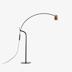 a black floor lamp with a white background