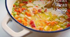 a white bowl filled with soup on top of a table