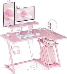 a pink computer desk with two monitors on it