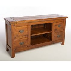 an old wooden cabinet with two drawers on one side and a shelf on the other