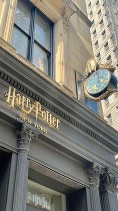 the entrance to harry potter new york with a clock on it's front door