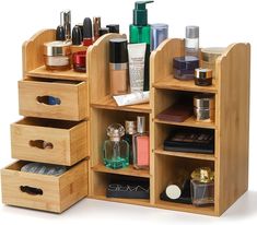 a wooden shelf with drawers containing cosmetics and personal care items